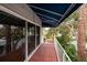 Spacious balcony with tile flooring and a view of lush greenery at 407 Bay View St, Safety Harbor, FL 34695