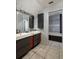 Modern bathroom with double vanity and a separate tub at 407 Bay View St, Safety Harbor, FL 34695