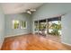 Bright bedroom with hardwood floors and access to balcony at 407 Bay View St, Safety Harbor, FL 34695