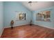 Bright bedroom featuring hardwood floors and dual windows at 407 Bay View St, Safety Harbor, FL 34695