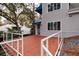 Spacious red tile deck with metal railings, offering backyard views at 407 Bay View St, Safety Harbor, FL 34695