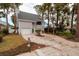 Two-story house with gray siding, two-car garage, and a landscaped front yard at 407 Bay View St, Safety Harbor, FL 34695