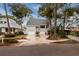 Two-story house with gray siding, two-car garage, and a landscaped front yard at 407 Bay View St, Safety Harbor, FL 34695