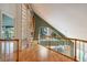 Upper hallway with built-in shelving and hardwood floors at 407 Bay View St, Safety Harbor, FL 34695