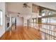 Open living space with hardwood floors, high ceilings, and a loft area at 407 Bay View St, Safety Harbor, FL 34695