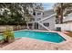 Inviting pool area with brick pavers and lounge chairs at 407 Bay View St, Safety Harbor, FL 34695