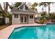 Private pool house with double doors and a spacious deck at 407 Bay View St, Safety Harbor, FL 34695