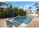 Relaxing pool with floating chairs and water feature at 431 Rafael Ne Blvd, St Petersburg, FL 33704