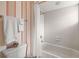 Simple bathroom with shower/tub combo and white tile at 4339 Cheval Blvd, Lutz, FL 33558