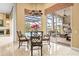 Breakfast nook with glass-top table and view of pool and patio at 4339 Cheval Blvd, Lutz, FL 33558