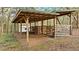 Large wooden animal shelter with multiple stalls at 4540 Oakfield Cir, Dade City, FL 33523