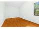 Bright bedroom with wood flooring and large window at 4540 Oakfield Cir, Dade City, FL 33523