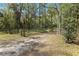 Private gated driveway leading to a home at 4540 Oakfield Cir, Dade City, FL 33523