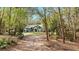 House nestled amongst the trees, driveway to the home at 4540 Oakfield Cir, Dade City, FL 33523