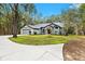 House exterior showcasing a well-maintained lawn and circular driveway at 4540 Oakfield Cir, Dade City, FL 33523