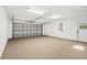 Spacious garage with overhead door and ample storage at 4540 Oakfield Cir, Dade City, FL 33523