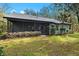 Spacious screened porch with a view of the backyard at 4540 Oakfield Cir, Dade City, FL 33523