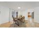 Light-filled dining room with modern table and chairs near kitchen at 4549 Madison St, New Port Richey, FL 34652