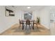 Light-filled dining room with modern table and chairs near kitchen at 4549 Madison St, New Port Richey, FL 34652