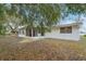 Ranch style home with covered patio and fenced backyard at 4549 Madison St, New Port Richey, FL 34652