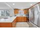 Modern kitchen with light wood cabinets and white countertops at 4549 Madison St, New Port Richey, FL 34652