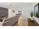 Bright living room features a gray sofa and wood-paneled accent wall at 4549 Madison St, New Port Richey, FL 34652