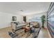 Bright living room with comfy sofas, a coffee table, and a stylish accent wall at 4549 Madison St, New Port Richey, FL 34652