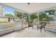 Relaxing screened porch with wicker chairs at 4549 Madison St, New Port Richey, FL 34652