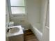 Clean bathroom with white tile, bathtub, and vanity at 4562 3Rd S Ave, St Petersburg, FL 33711