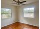 Bright bedroom with hardwood floors and two windows at 4562 3Rd S Ave, St Petersburg, FL 33711