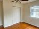 Bedroom with hardwood floors, double door closet and window at 4562 3Rd S Ave, St Petersburg, FL 33711