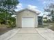 Single car detached garage with white door and concrete driveway at 4562 3Rd S Ave, St Petersburg, FL 33711