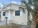 Tan house with white trim, front porch, and palm tree at 4562 3Rd S Ave, St Petersburg, FL 33711