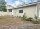 Exterior view of the house showing a light beige siding at 4562 3Rd S Ave, St Petersburg, FL 33711