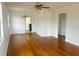 Bright living room with hardwood floors and ceiling fan at 4562 3Rd S Ave, St Petersburg, FL 33711