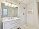 Modern bathroom with white vanity, large shower, and updated fixtures at 4920 Steel Dust Ln, Lutz, FL 33559