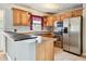 Kitchen with stainless steel appliances and wood cabinets at 4920 Steel Dust Ln, Lutz, FL 33559