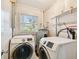 Laundry room with washer, dryer and water heater at 4920 Steel Dust Ln, Lutz, FL 33559