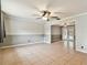 Large living room with tile floors and neutral-toned walls at 4920 Steel Dust Ln, Lutz, FL 33559