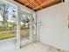 Screened porch with access to the backyard at 4920 Steel Dust Ln, Lutz, FL 33559