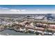 Aerial view of waterfront townhomes near a marina and bridge at 5000 Culbreath Key Way # 2-202, Tampa, FL 33611