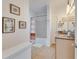 Well-lit bathroom with a shower-tub combo, single sink vanity, and decorative artwork on the walls at 5000 Culbreath Key Way # 2-202, Tampa, FL 33611