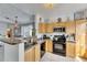 Well-lit kitchen featuring a breakfast bar, granite countertops and stainless appliances at 5000 Culbreath Key Way # 2-202, Tampa, FL 33611