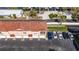 Aerial view of townhomes with terracotta tile roofs and attached garages near boat docks at 5000 Culbreath Key Way # 2-202, Tampa, FL 33611