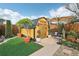 Landscaped backyard with storage shed and seating at 5117 Lesher Ct, Tampa, FL 33624