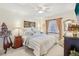 Comfortable bedroom with ceiling fan, large bed, and ample closet space at 5117 Lesher Ct, Tampa, FL 33624