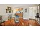 Bright dining area with hardwood floors and a glass-top table at 5117 Lesher Ct, Tampa, FL 33624