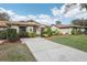 Well-maintained house exterior with manicured landscaping at 5117 Lesher Ct, Tampa, FL 33624