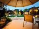 Relaxing patio scene with an umbrella and view of the backyard at 5117 Lesher Ct, Tampa, FL 33624