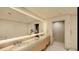 Modern bathroom with double vanity and large mirror at 5120 Marina Way # 31101, Tampa, FL 33611